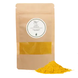 Das Bild zeigt einen Haufen Curry indisch vor einer Verpackung.